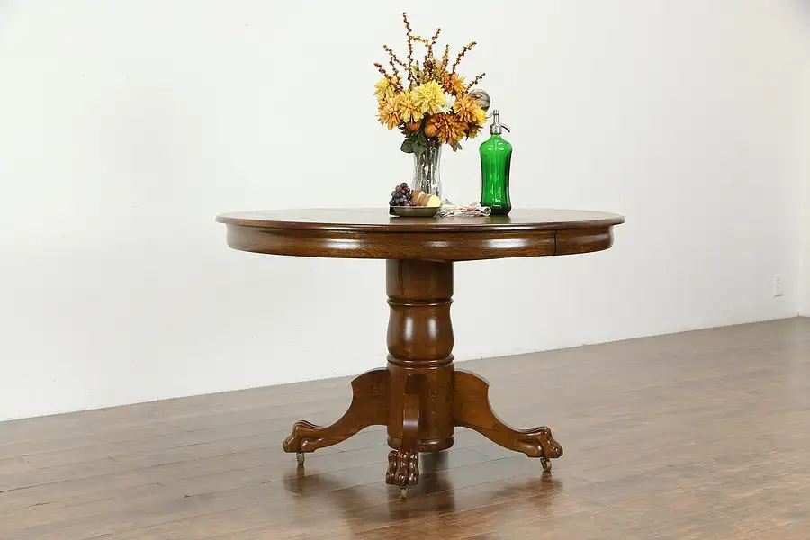 Main image of Victorian Antique 4'' Round Oak Dining Table, 2 leaves, Lion Paw Feet