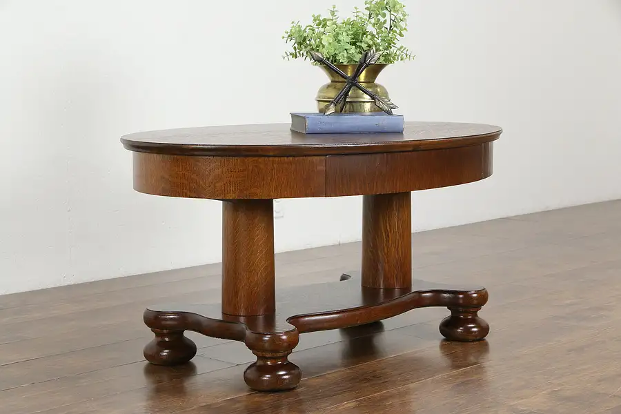 Main image of Oval Antique Quarter Sawn Oak Coffee Table, Base with Columns, Bun Feet