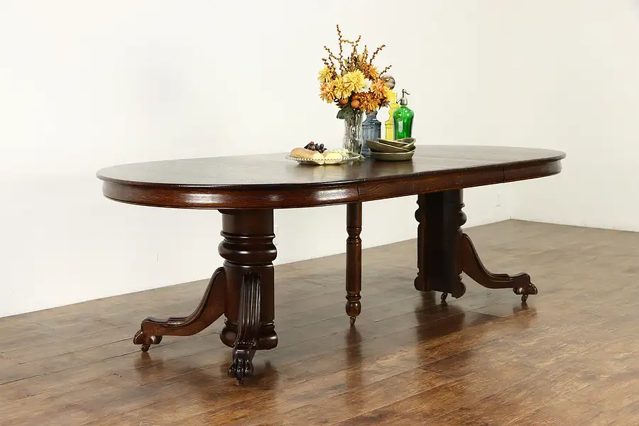 Main image of Oak Antique 4' Round Dining Table, Lion Paw Feet, 4 Leaves, Extends 8'