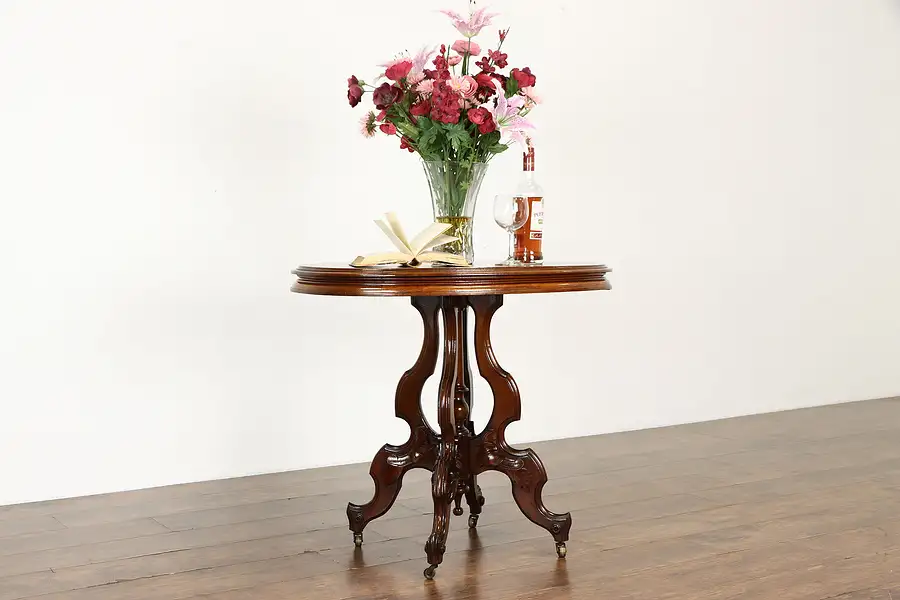 Main image of Victorian Antique Oval Carved Walnut Lamp or Parlor Table