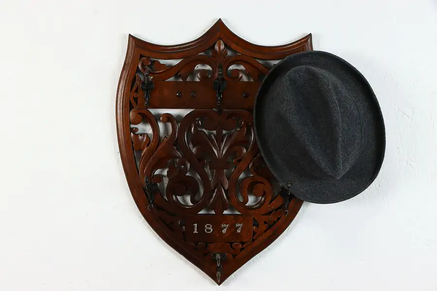 Main image of Victorian Antique Carved Walnut Shield Hat or Coatrack, Signed 1877