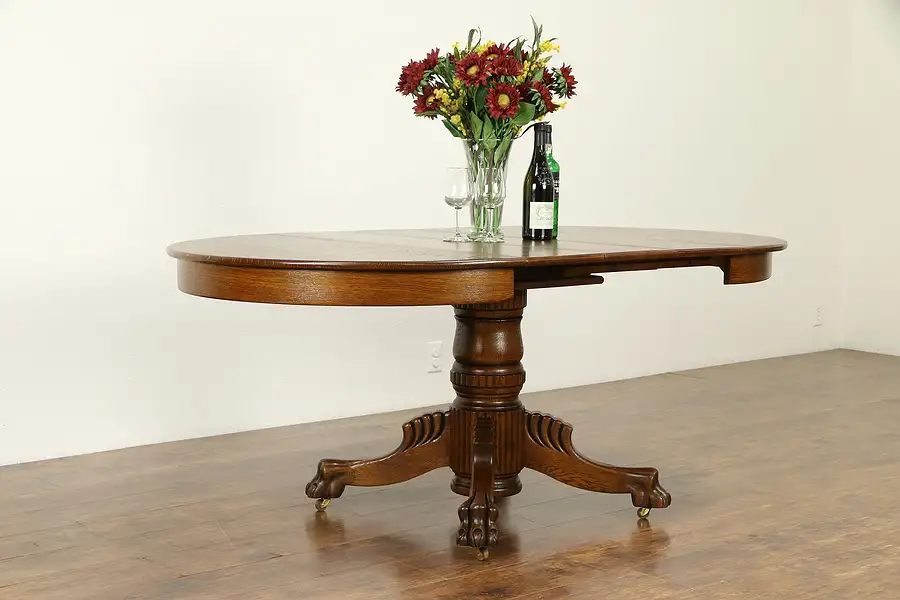 Main image of Round 42" Oak Antique Dining Table, 3 Leaves, Lion Paw Feet, Extends 6'