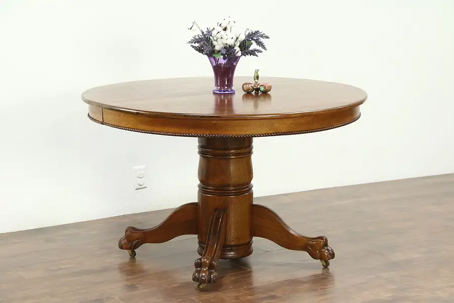 Main image of Round Oak 48" Antique 1900 Dining Table, 2 Leaves, Lion Paw Feet