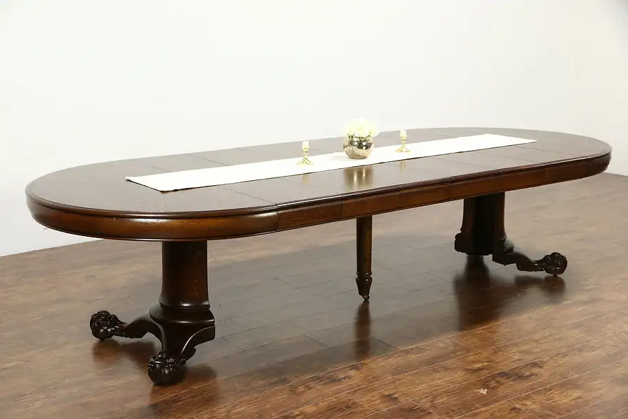 Main image of Round Oak 52" Antique 1900 Dining Table, Claw Feet, 6 Leaves, Extends 10' 4"