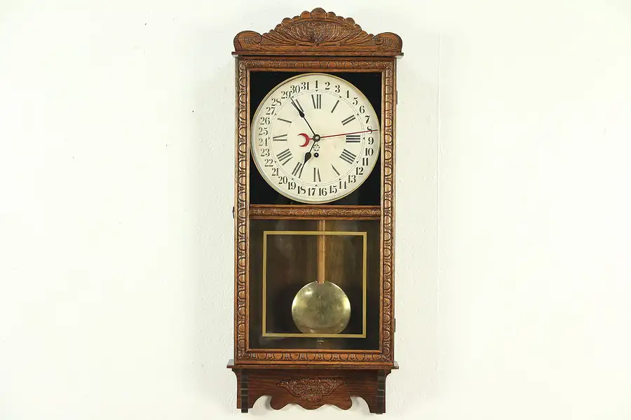 Main image of New Haven Victorian Antique 1890's Carved Oak Calendar Clock, Wavy Glass