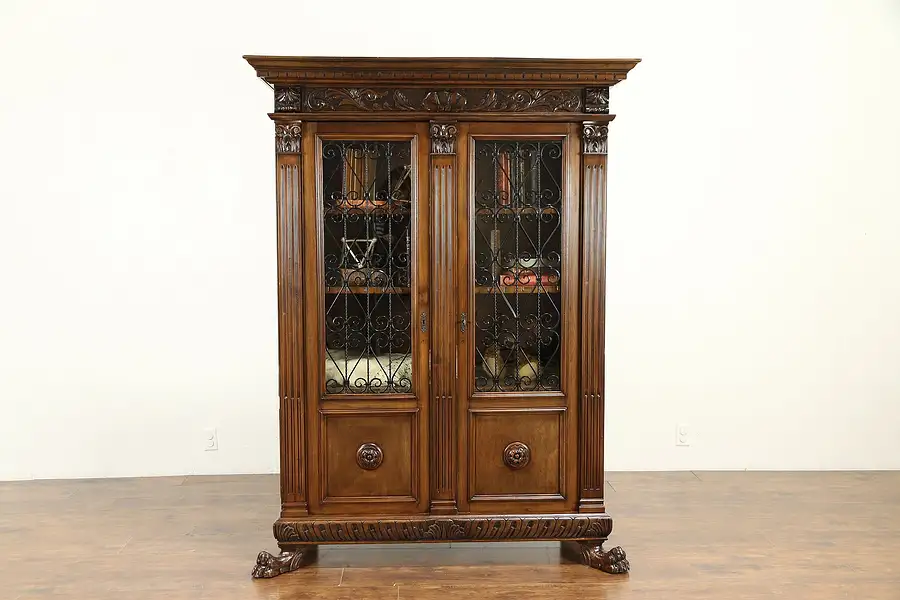 Main image of Italian Carved Walnut Antique 1900 Bookcase, Iron Grill & Glass Doors