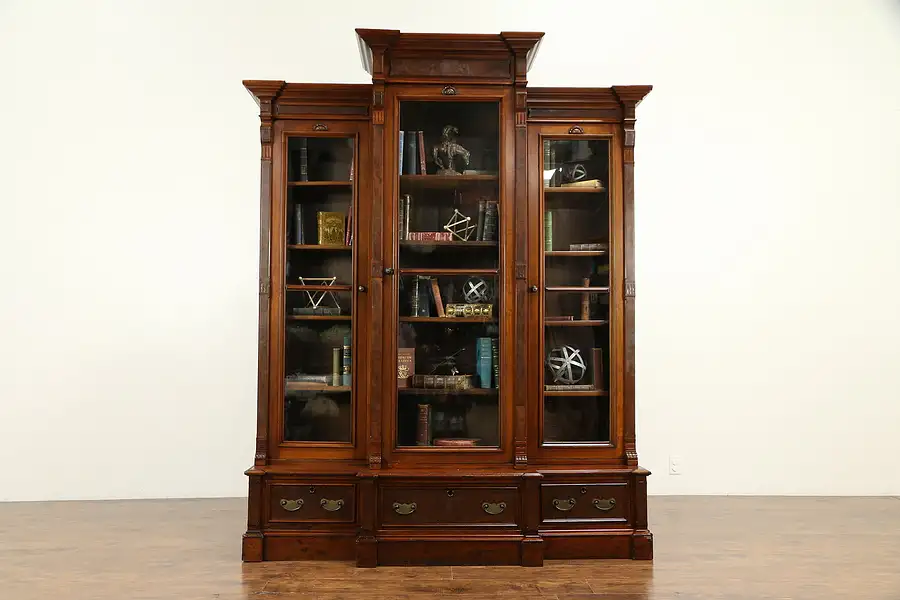 Main image of Victorian Eastlake Antique Walnut Triple Bookcase, Wavy Glass Doors