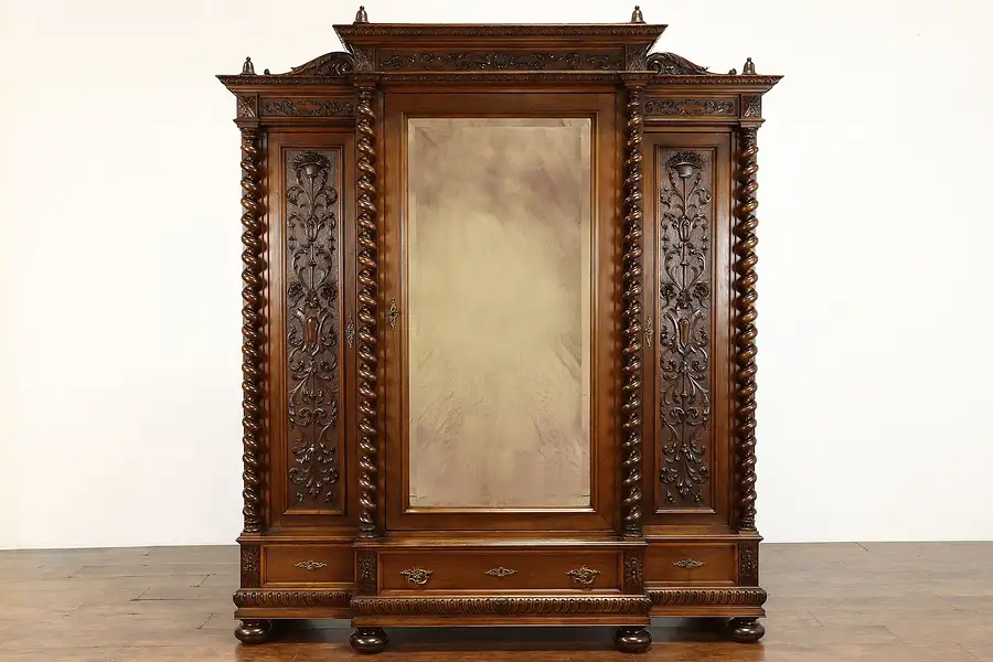 Main image of Italian Renaissance Carved Walnut Triple Armoire Wardrobe, Columns Mirror