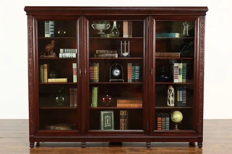 Main image of Carved Mahogany Antique Triple Office Bookcase with Wavy Glass Doors