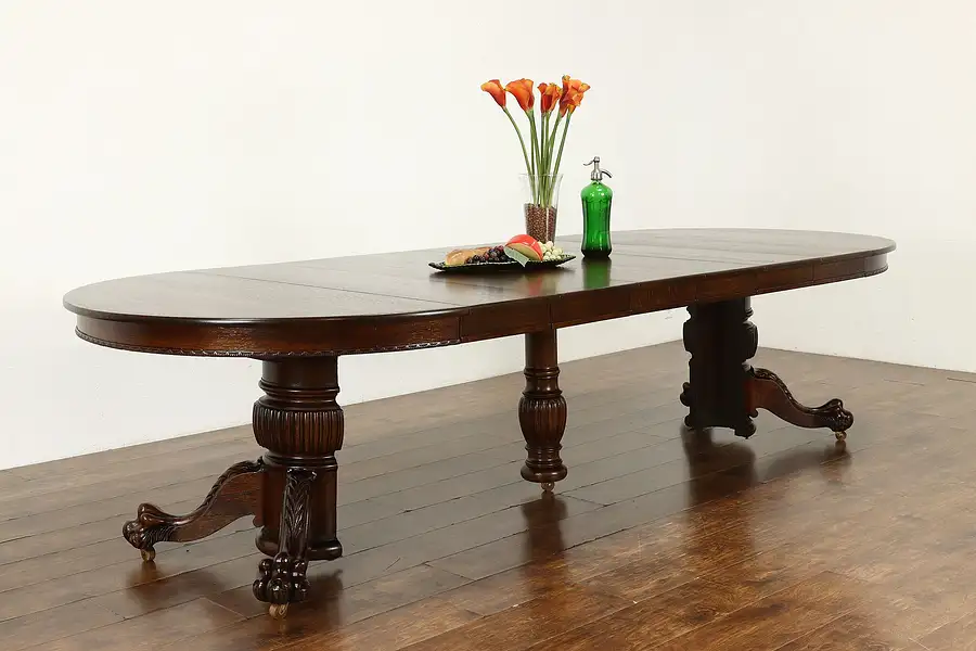 Main image of Victorian Antique Oak 48" Dining Table, 6 Leaves, Paw Feet, Extends 10'