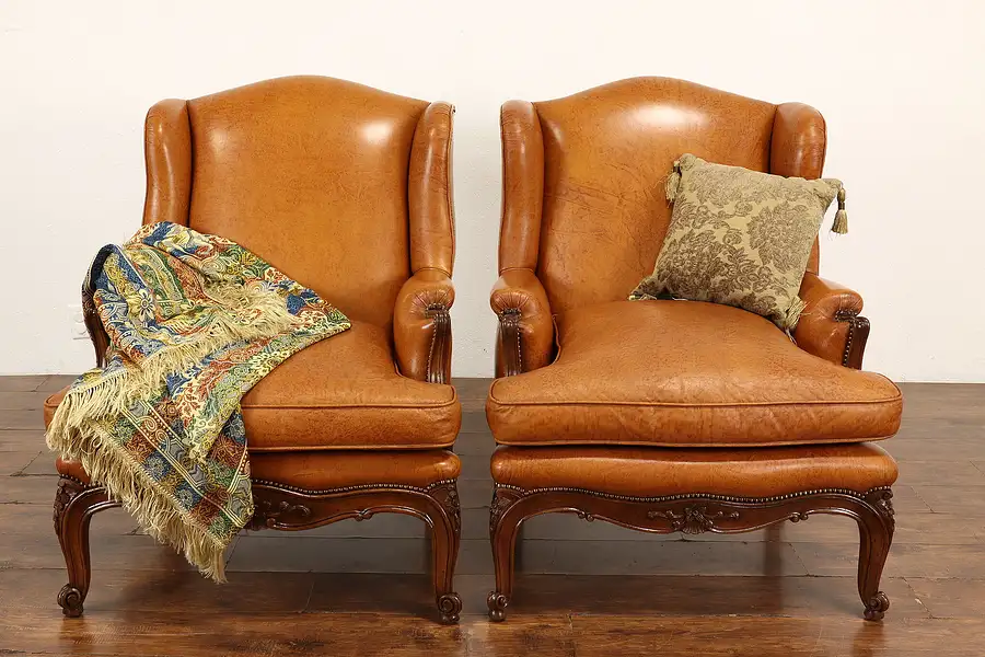 Main image of Pair of Scandinavian Vintage Carved Walnut & Leather Wingback Chairs