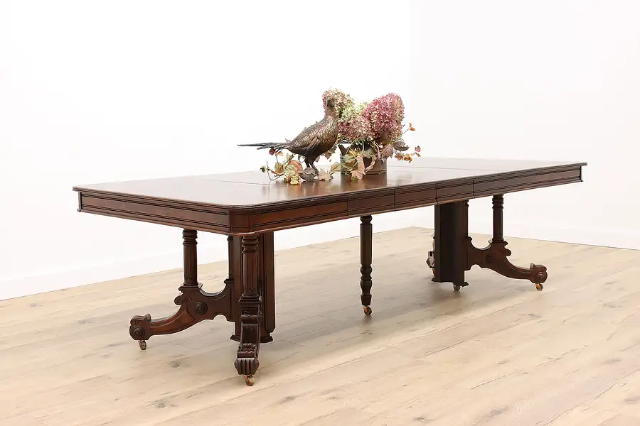 Main image of Victorian Eastlake Antique 47" Walnut Dining Table, 5 Leaves Extends 9'