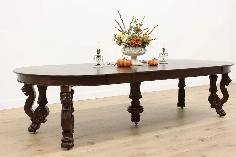 Main image of Victorian Antique 52" Round Oak 10' Dining Table, 6 Leaves, Carved Lions