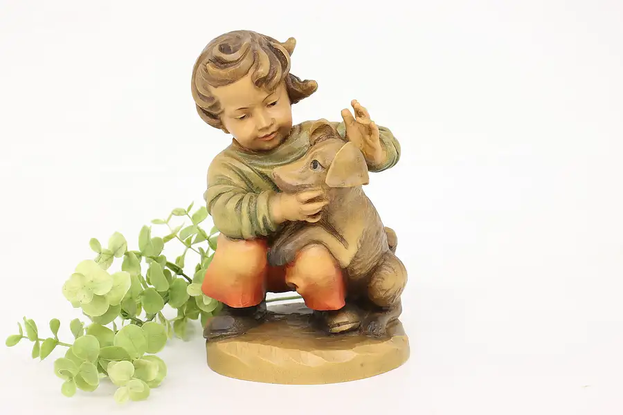 Main image of Swiss Hand Carved Vintage Folk Art Statue Child with Dog Sculpture