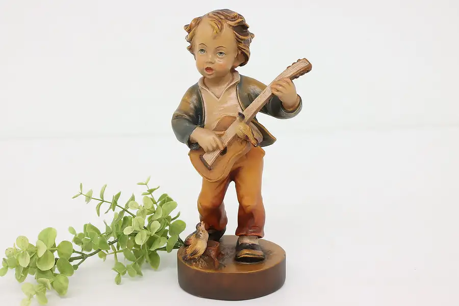 Main image of Swiss Hand Carved Vintage Folk Art Statue, Boy Playing Guitar Sculpture