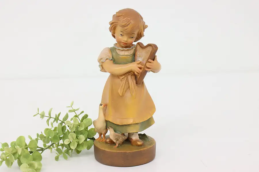 Main image of Swiss Hand Carved Vintage Folk Art Statue, Girl Playing Harp Sculpture