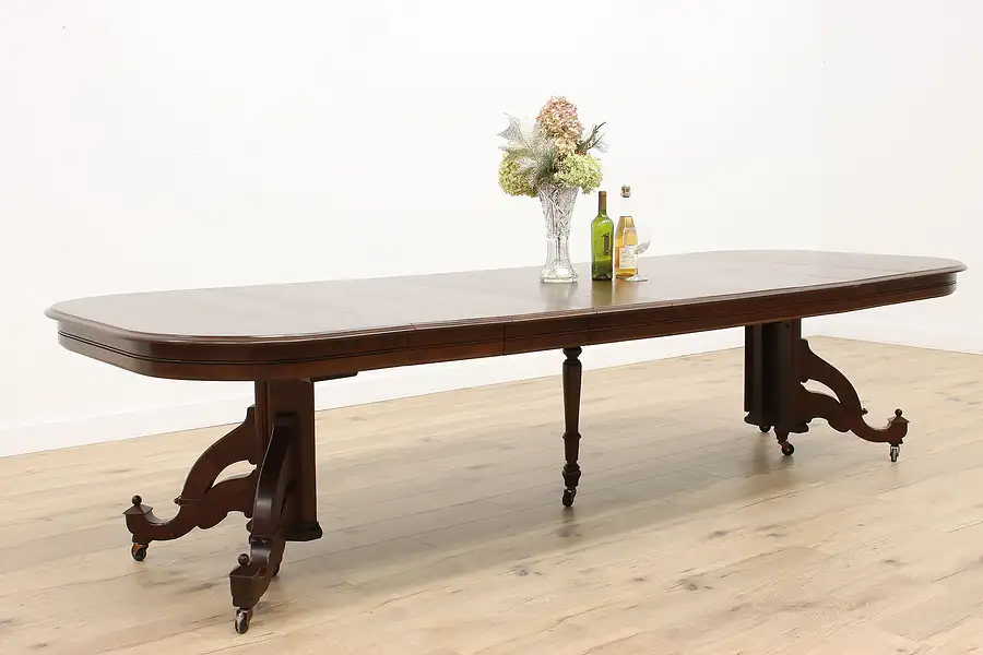 Main image of Victorian Eastlake Antique 48" Walnut Dining Table, 7 Leaves Extends 11'