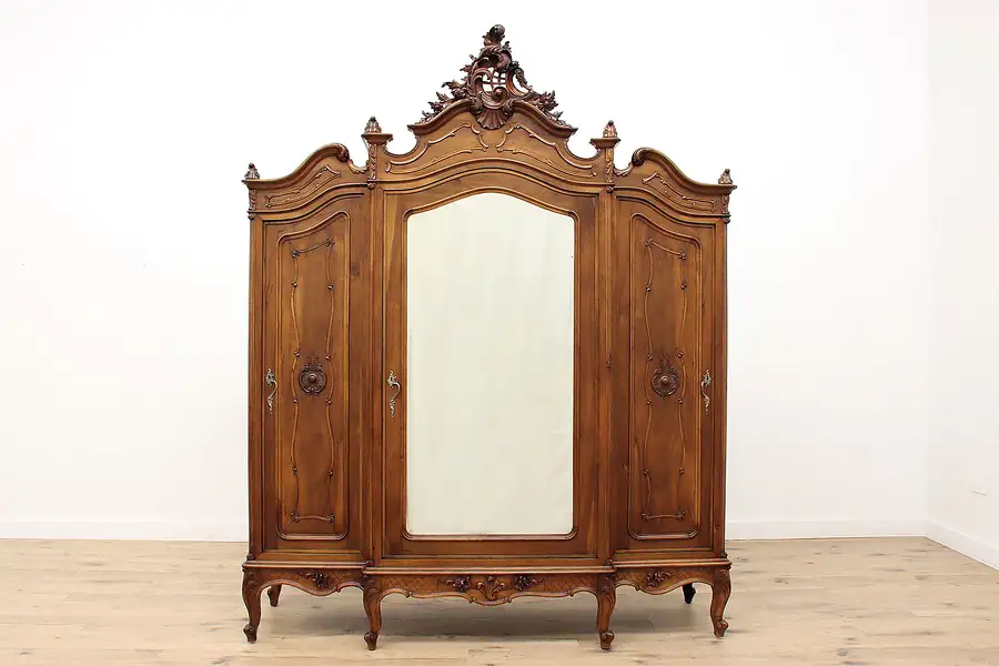 Main image of French Antique Carved Walnut Triple Armoire, Wardrobe, or Closet