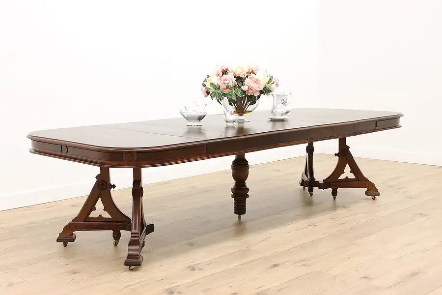 Main image of Victorian Eastlake Antique 48" Walnut Dining Table, 6 Leaves Extends 10'