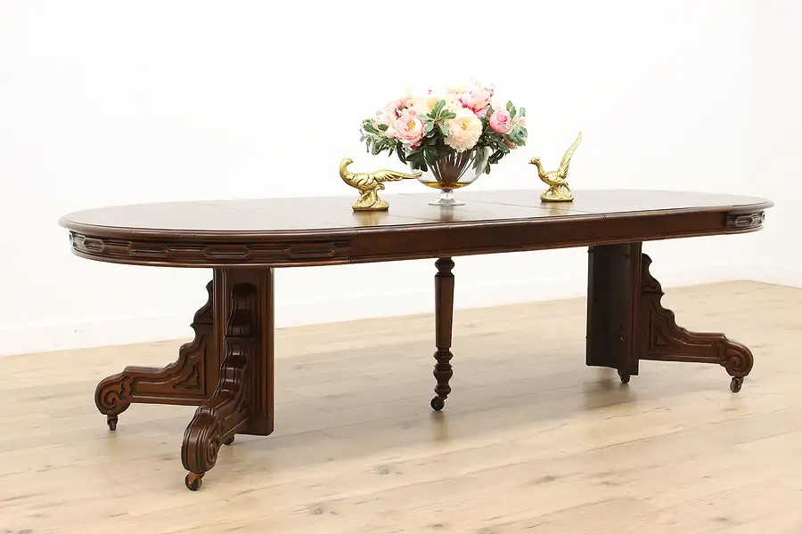 Main image of Victorian Antique 48" Carved Walnut Dining Table, 5 Leaves Extends 9'