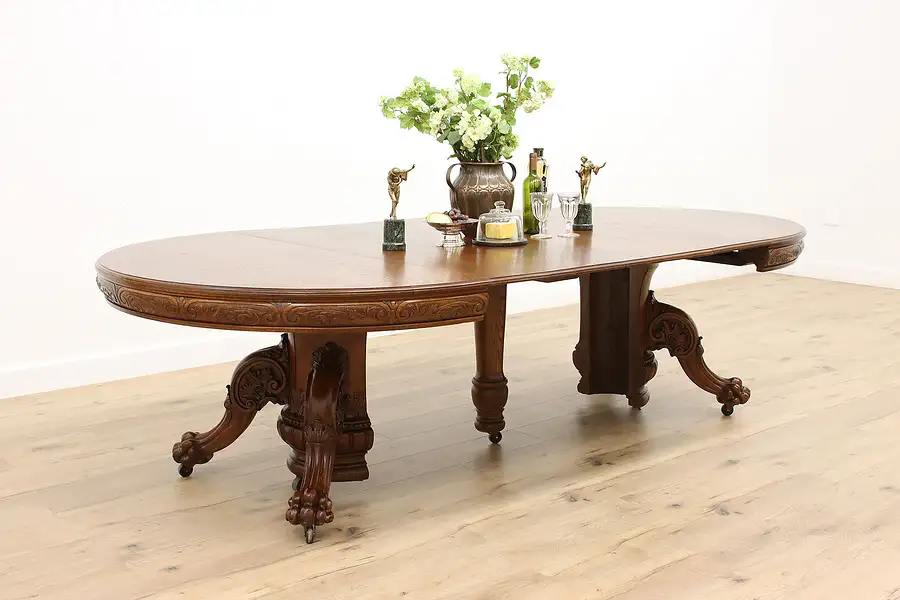 Main image of Victorian Antique 5' Round Oak Dining Table, Paw Feet, Extends almost 14'