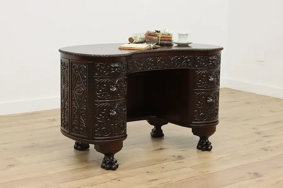 Main image of Victorian Antique Carved Mahogany Kidney Shape Desk Pawfeet