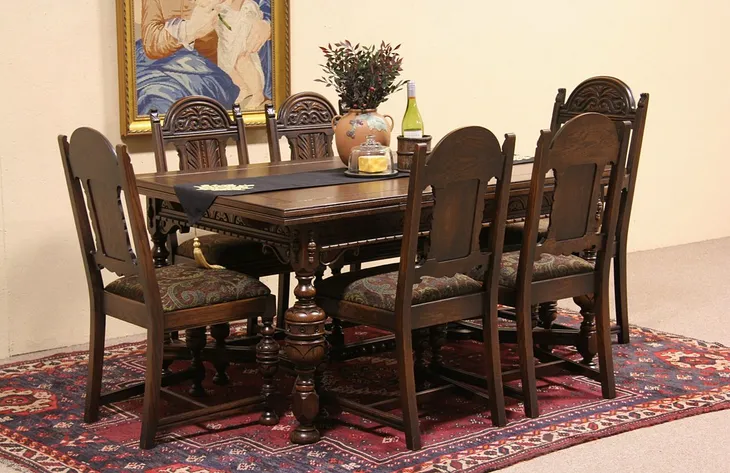 Tudor Carved Oak 1925 Dining Set, Table, 2 Leaves & 6 Chairs