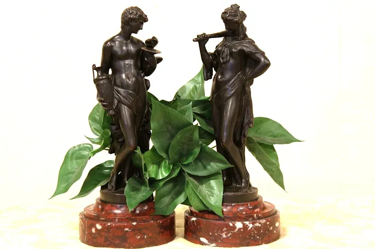 Two Classical Bronze Sculptures of a Woman and Man