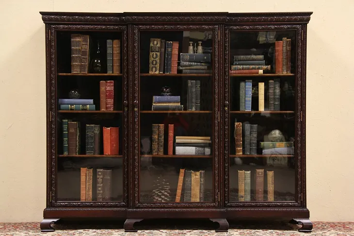 Triple Carved 1910 Antique Bookcase, Wavy Glass Doors