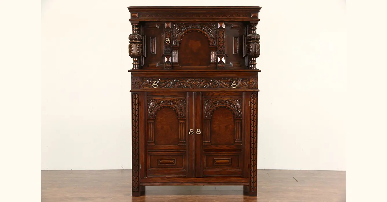 English Tudor 1925 Antique China or Bar Cabinet, Carved Oak & Burl