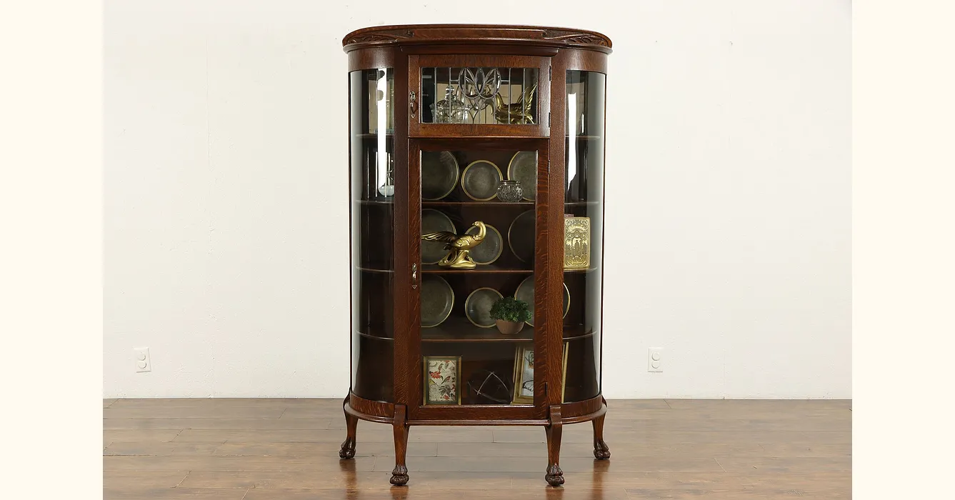 Antique curio cabinet with store leaded glass