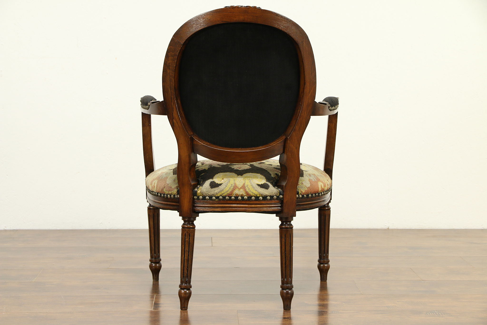 19th century French Louis XVI style arm chair with tapestry upholstery.