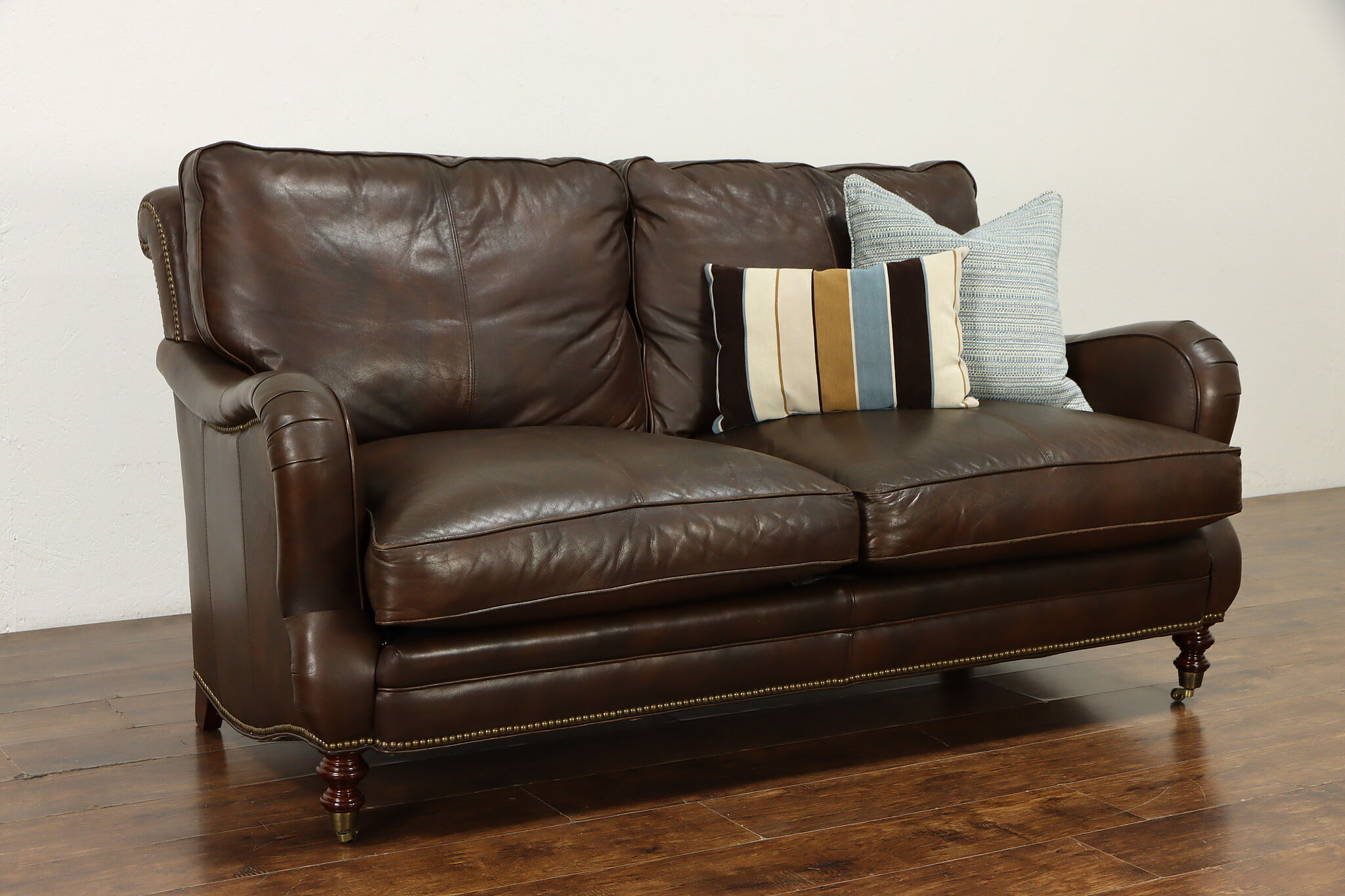 leather sofa with brass nailheads