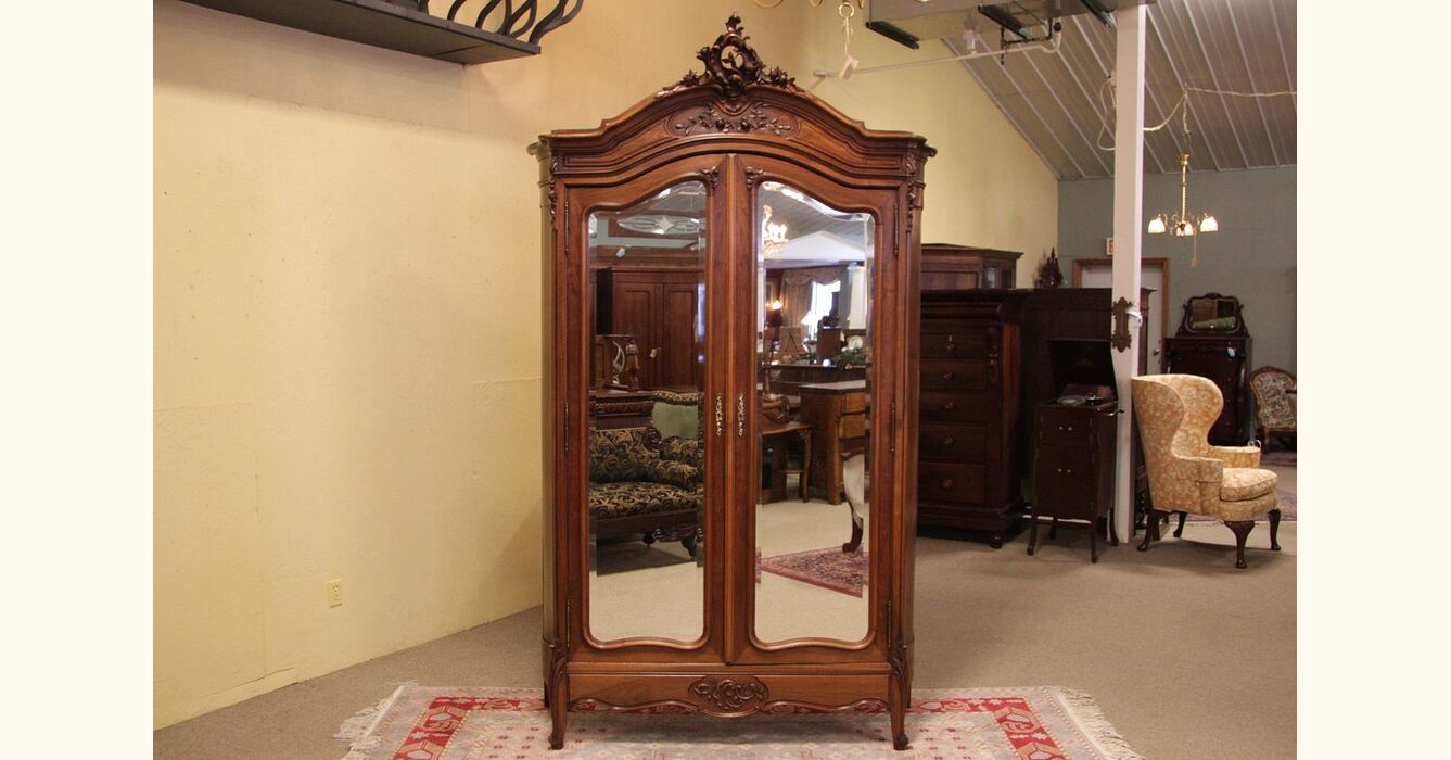 Carved Antique French Armoire with Curved Sides